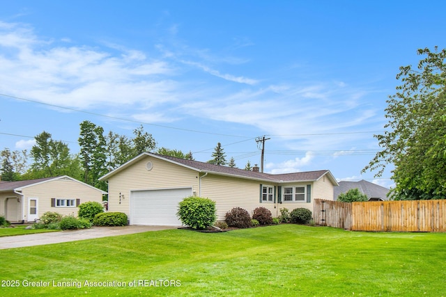 4626 Blackberry Ln, Lansing, MI 48917 - ranch-style home with concrete driveway and a garage