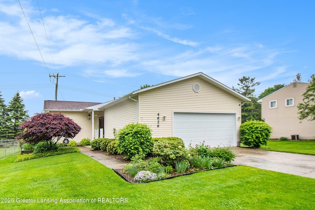 4626 Blackberry Ln, Lansing, MI 48917 - view of front of house featuring concrete driveway and an attached garage