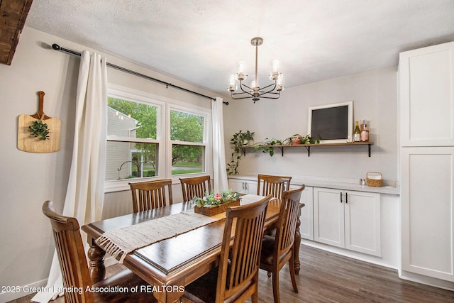 4626 Blackberry Ln, Lansing, MI 48917 - dining space with a chandelier, dark wood-type flooring, and baseboards