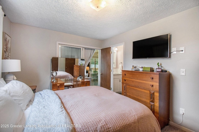4626 Blackberry Ln, Lansing, MI 48917 - bedroom with a textured ceiling and ensuite bathroom
