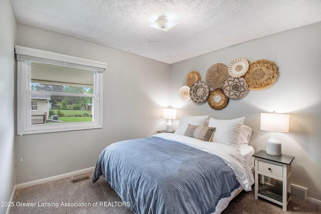 4626 Blackberry Ln, Lansing, MI 48917 - carpeted bedroom with baseboards and a textured ceiling