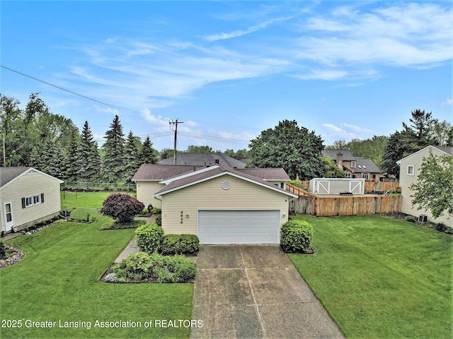 4626 Blackberry Ln, Lansing, MI 48917 - view of front of home with driveway and a garage
