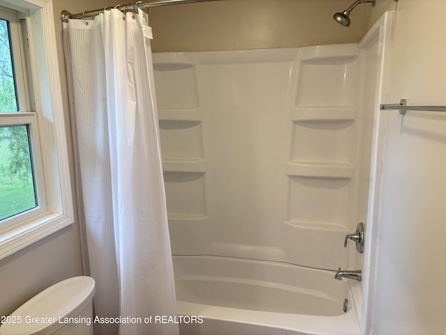 4684 Sherman Rd, Charlotte, MI 48813 - bathroom featuring shower / bath combo with shower curtain and toilet