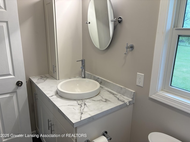 4684 Sherman Rd, Charlotte, MI 48813 - bathroom featuring vanity and toilet