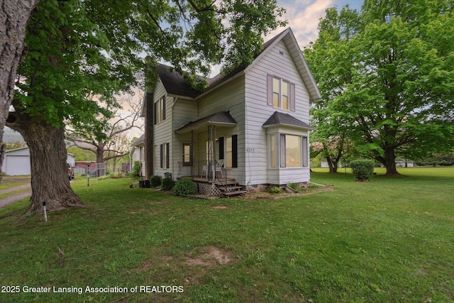 6275 E Clark Rd, Bath, MI 48808 - view of side of property with a yard