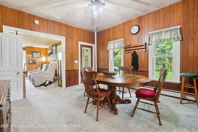6275 E Clark Rd, Bath, MI 48808 - carpeted dining space featuring wooden walls and ceiling fan