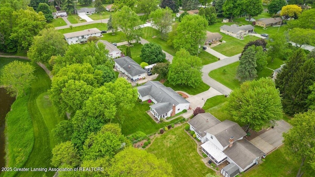 14921 Karl Dr, Lansing, MI 48906 - aerial perspective of suburban area featuring a tree filled landscape