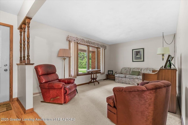 14921 Karl Dr, Lansing, MI 48906 - living area featuring baseboards and carpet flooring