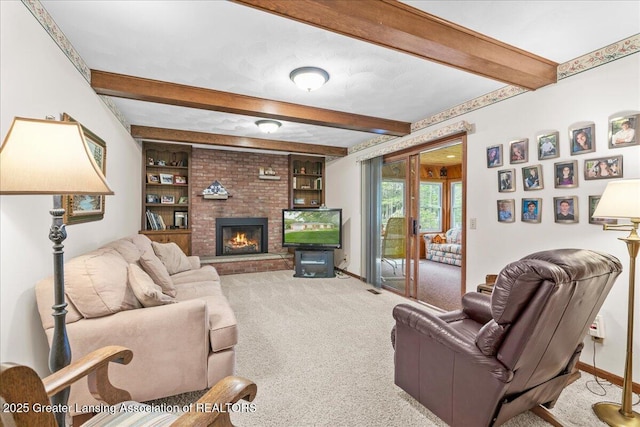 14921 Karl Dr, Lansing, MI 48906 - living room with beam ceiling, carpet, a fireplace, and baseboards