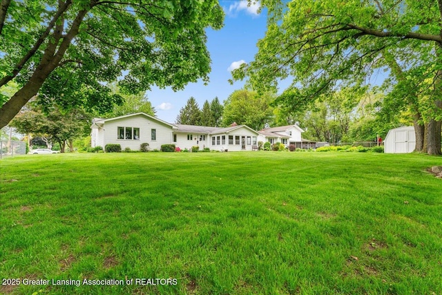 14921 Karl Dr, Lansing, MI 48906 - view of front facade featuring a front lawn