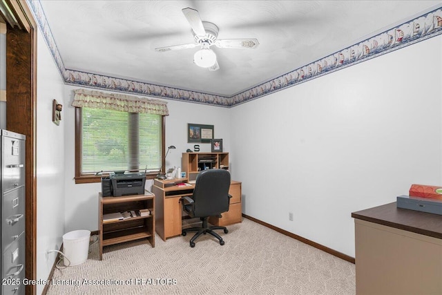 14921 Karl Dr, Lansing, MI 48906 - home office featuring light carpet, baseboards, and a ceiling fan
