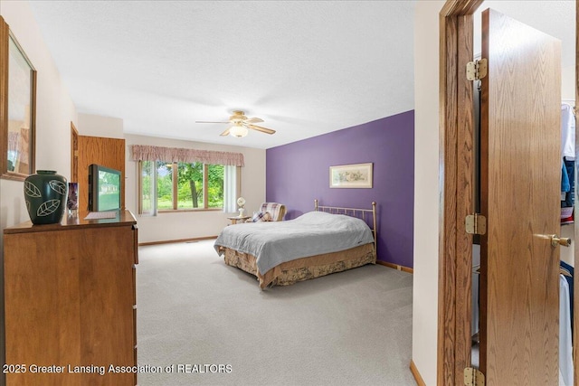 14921 Karl Dr, Lansing, MI 48906 - bedroom featuring carpet, baseboards, and ceiling fan