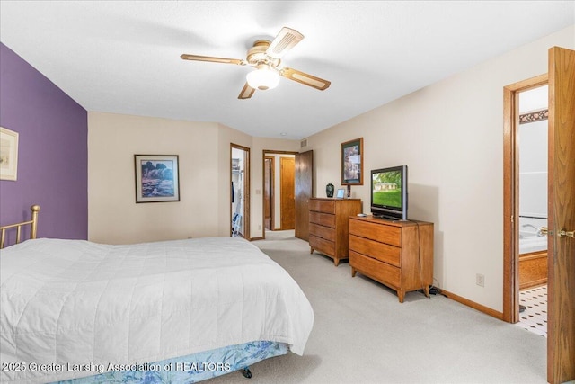 14921 Karl Dr, Lansing, MI 48906 - bedroom with light colored carpet, a ceiling fan, and baseboards
