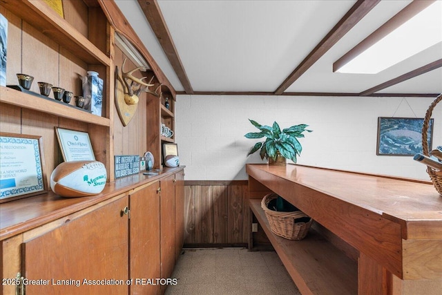 14921 Karl Dr, Lansing, MI 48906 - office with wood walls, light floors, and concrete block wall