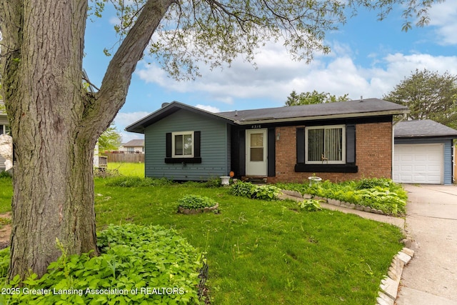 4316 Dumfries Cir, Lansing, MI 48911 - view of front facade with brick siding, concrete driveway, a front yard, and roof with shingles