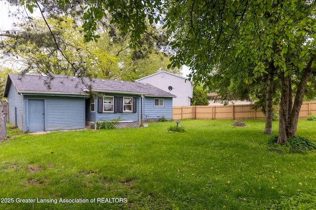 4316 Dumfries Cir, Lansing, MI 48911 - back of property with a shingled roof