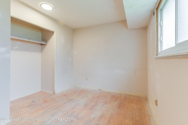 4316 Dumfries Cir, Lansing, MI 48911 - unfurnished bedroom with light wood-style flooring and baseboards