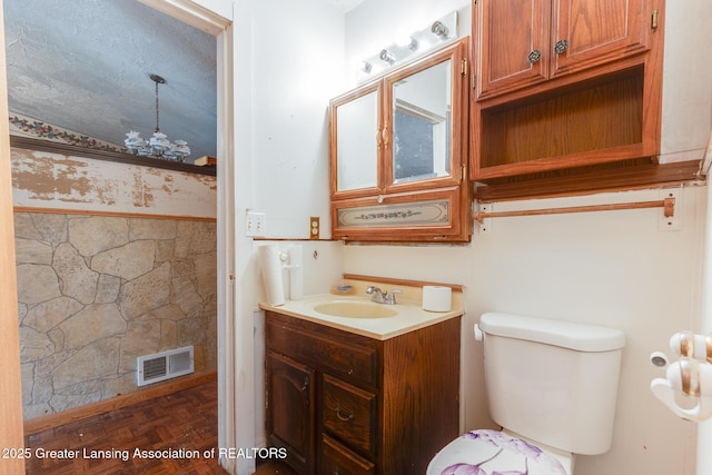 4316 Dumfries Cir, Lansing, MI 48911 - bathroom featuring vanity, a chandelier, and toilet