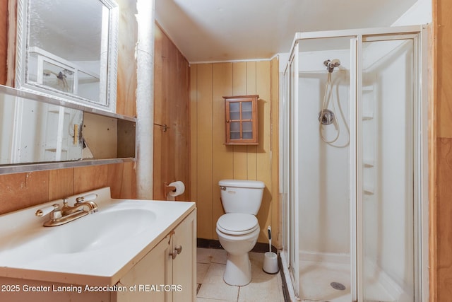 4316 Dumfries Cir, Lansing, MI 48911 - full bathroom with a stall shower, vanity, toilet, wood walls, and tile patterned flooring