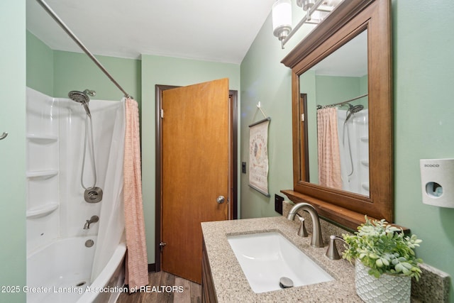 445 S Oak St, Maple Rapids, MI 48853 - bathroom with vanity, shower / tub combo, and wood finished floors