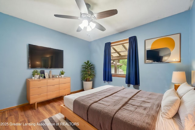 445 S Oak St, Maple Rapids, MI 48853 - bedroom with wood finished floors, baseboards, and a ceiling fan
