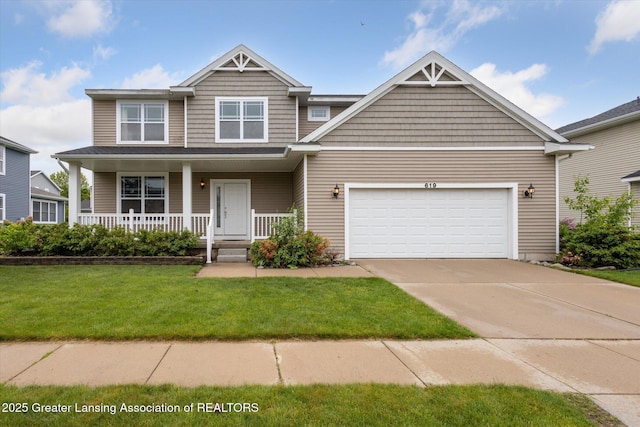 619 Willet Way E, Lansing, MI 48823 - craftsman inspired home with concrete driveway, a front yard, covered porch, and a garage