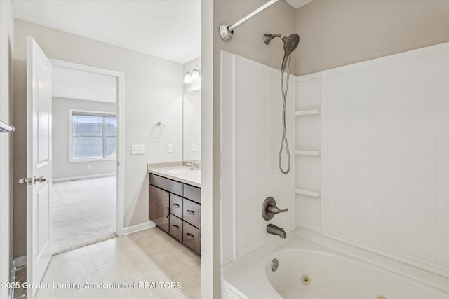 619 Willet Way E, Lansing, MI 48823 - bathroom featuring vanity, a combined bath / shower with jetted tub, tile patterned flooring, and baseboards