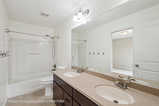 619 Willet Way E, Lansing, MI 48823 - full bath featuring bathtub / shower combination, double vanity, toilet, and tile patterned floors