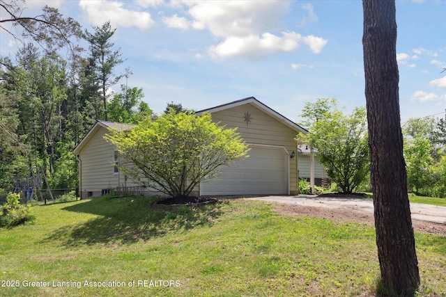7050 E Eaton Hwy, Sunfield, MI 48890 - view of front of property with driveway and an attached garage