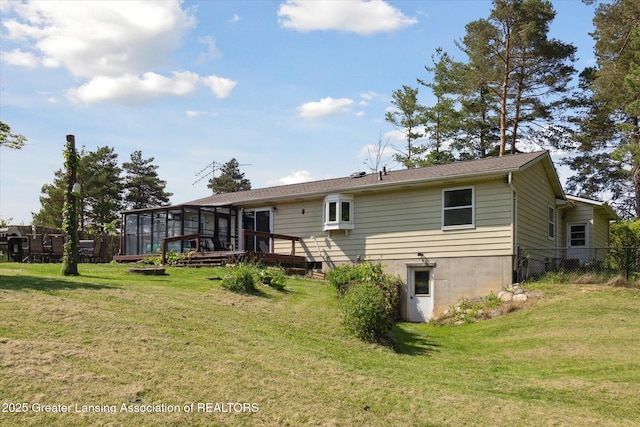 7050 E Eaton Hwy, Sunfield, MI 48890 - back of house with a sunroom and a wooden deck
