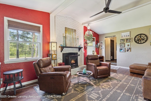 7050 E Eaton Hwy, Sunfield, MI 48890 - living area with wood finished floors, vaulted ceiling, baseboards, a ceiling fan, and a textured wall