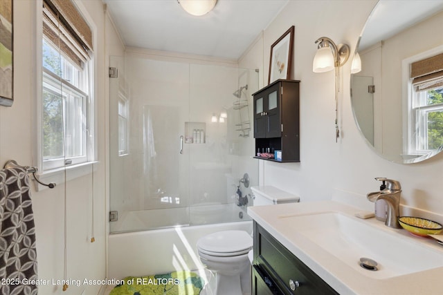 7050 E Eaton Hwy, Sunfield, MI 48890 - bathroom with toilet, vanity, and combined bath / shower with glass door