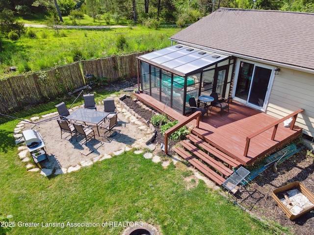 7050 E Eaton Hwy, Sunfield, MI 48890 - wooden deck with outdoor dining space, a patio, and a sunroom