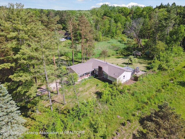 7050 E Eaton Hwy, Sunfield, MI 48890 - view from above of property featuring a heavily wooded area