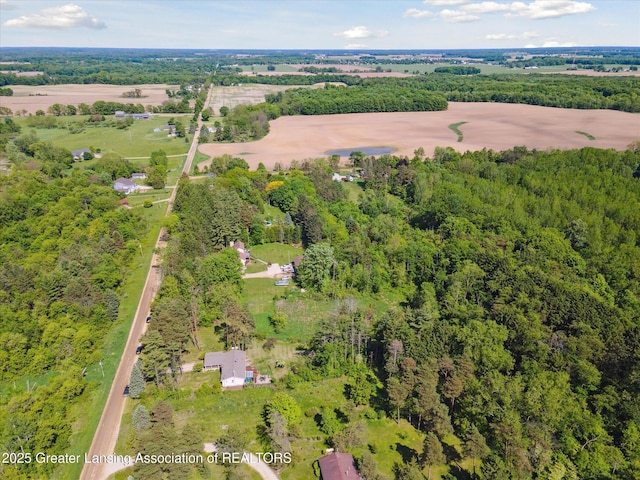 7050 E Eaton Hwy, Sunfield, MI 48890 - aerial overview of property's location with a heavily wooded area