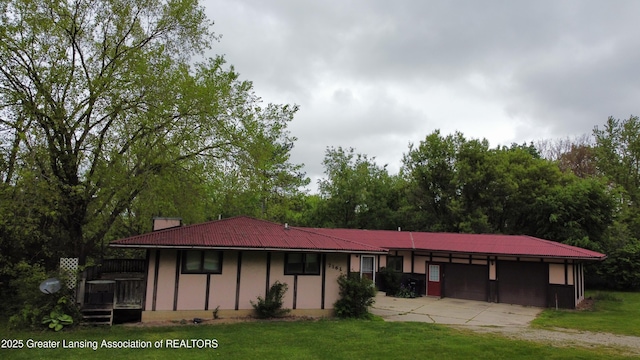 7161 E Eaton Hwy, Mulliken, MI 48861 - single story home with driveway, a front lawn, and an attached garage