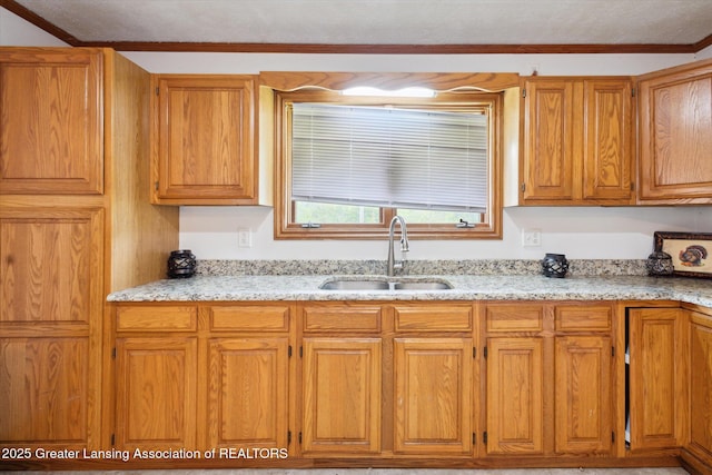 7161 E Eaton Hwy, Mulliken, MI 48861 - kitchen with a sink, brown cabinets, light stone countertops, and crown molding