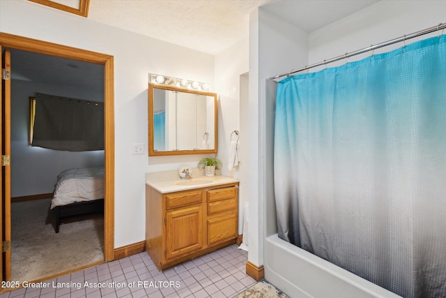 7161 E Eaton Hwy, Mulliken, MI 48861 - ensuite bathroom with vanity, shower / bath combo, baseboards, and tile patterned floors