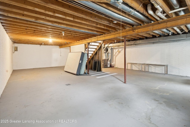 7161 E Eaton Hwy, Mulliken, MI 48861 - unfinished basement with stairs and heating unit