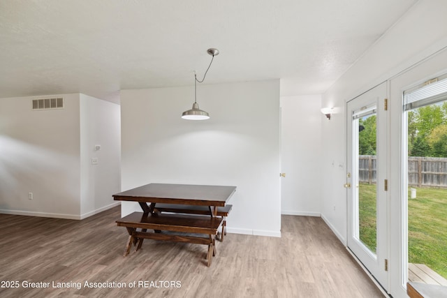 114 Walker Dr, Morrice, MI 48857 - dining room with wood finished floors and baseboards