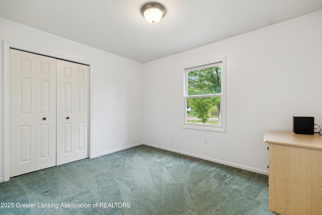 114 Walker Dr, Morrice, MI 48857 - unfurnished bedroom with carpet flooring, baseboards, and a closet