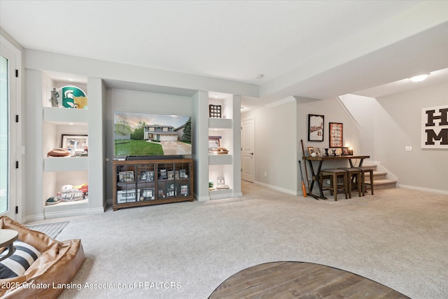16851 Meadowbrook Dr, Haslett, MI 48840 - carpeted living area with stairs and baseboards