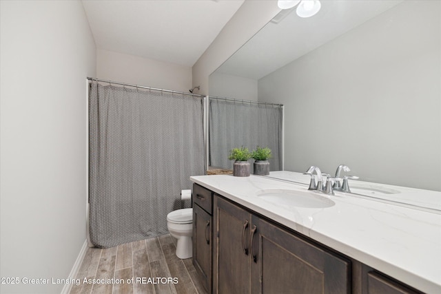 16851 Meadowbrook Dr, Haslett, MI 48840 - full bath featuring wood finished floors, vanity, toilet, and shower / tub combo with curtain