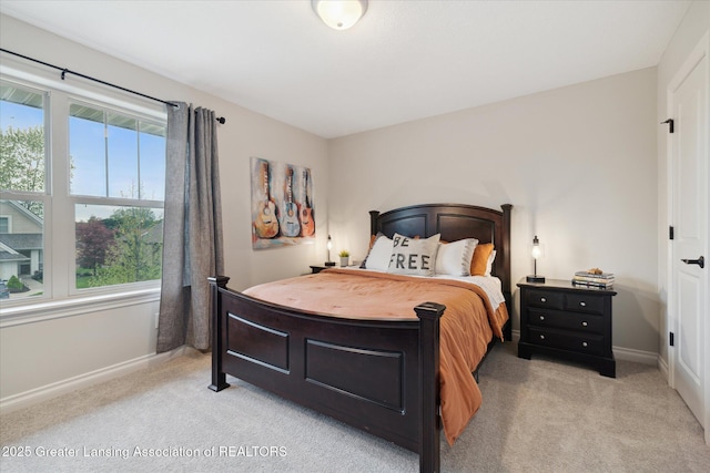 16851 Meadowbrook Dr, Haslett, MI 48840 - bedroom with light colored carpet, multiple windows, and baseboards