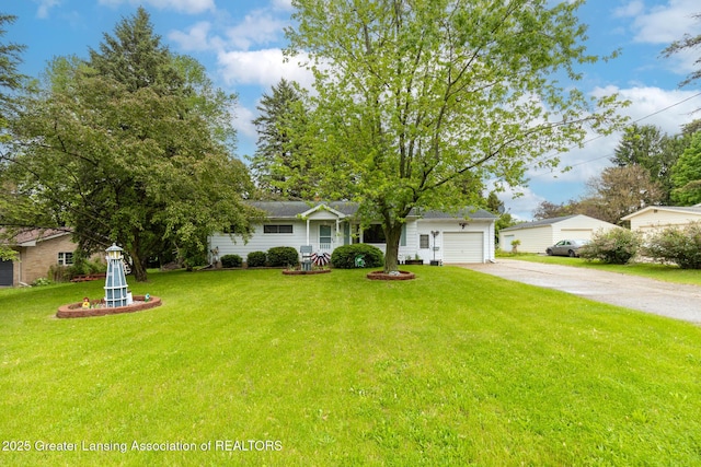 15157 Chetwyn Dr, Lansing, MI 48906 - view of front of house featuring driveway, a garage, and a front lawn
