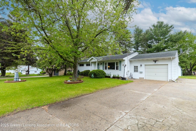 15157 Chetwyn Dr, Lansing, MI 48906 - view of front of house with a garage, driveway, a front lawn, and roof with shingles