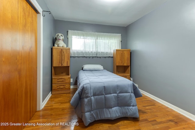 15157 Chetwyn Dr, Lansing, MI 48906 - bedroom featuring wood finished floors and baseboards