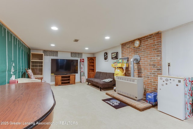 15157 Chetwyn Dr, Lansing, MI 48906 - living area featuring a wood stove, carpet floors, and recessed lighting