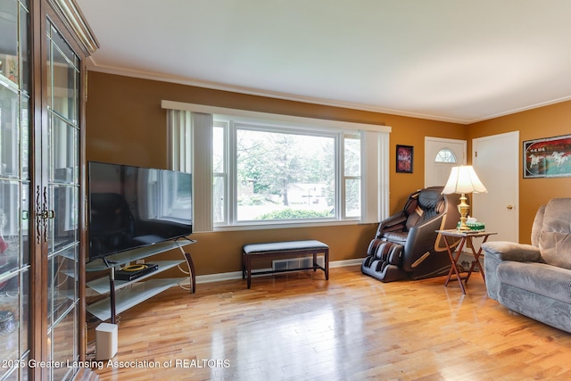 15157 Chetwyn Dr, Lansing, MI 48906 - living room with ornamental molding, wood finished floors, and baseboards