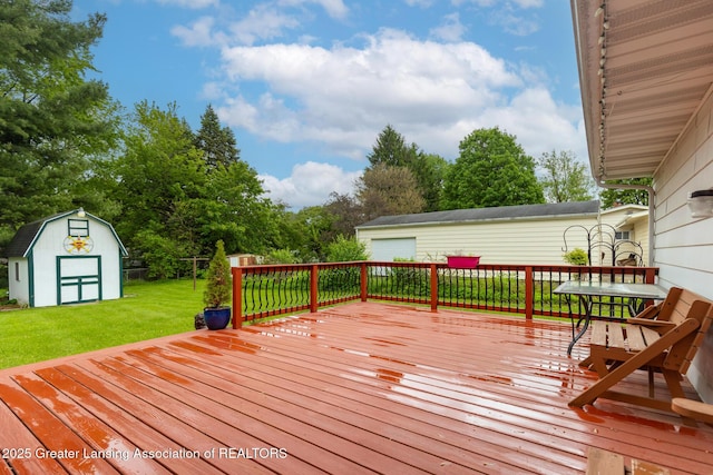 15157 Chetwyn Dr, Lansing, MI 48906 - wooden deck with a lawn, a garage, and view of scattered trees